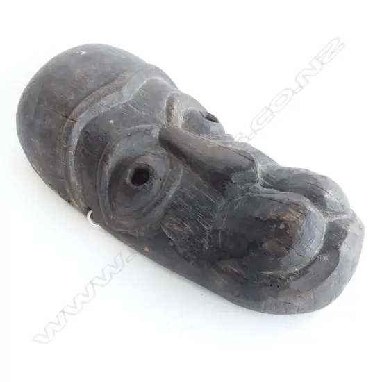 A vintage African tribal carved wooden mask,